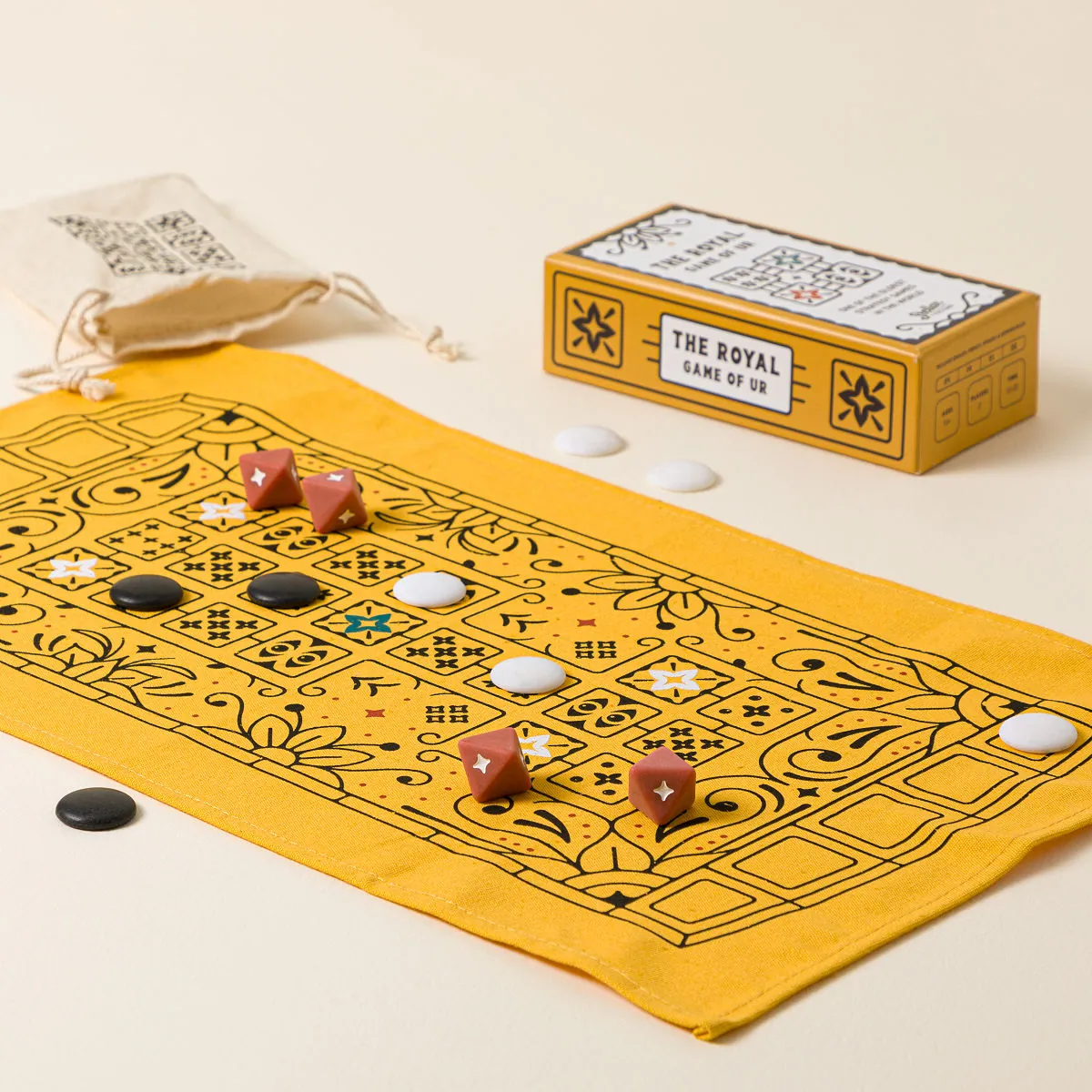 Game of Ur strategy game with fabric board, player stones, and four-sided dice
