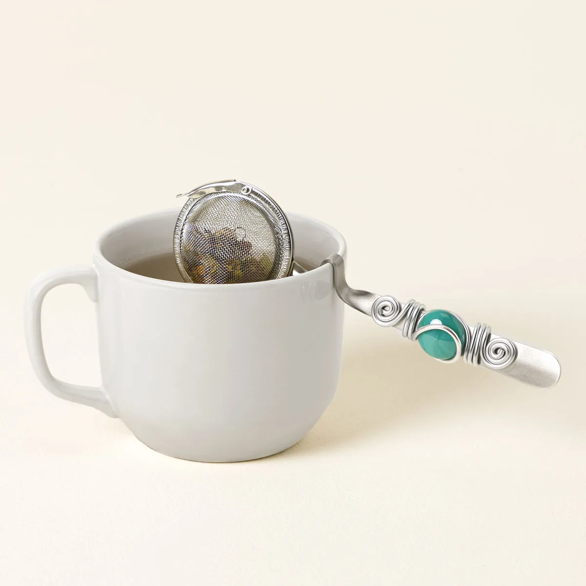 Easy Rest Tea Infuser with cup-rest handle and colorful glass marble